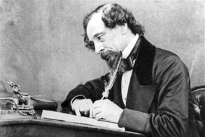 Charles Dickens at his writing desk.