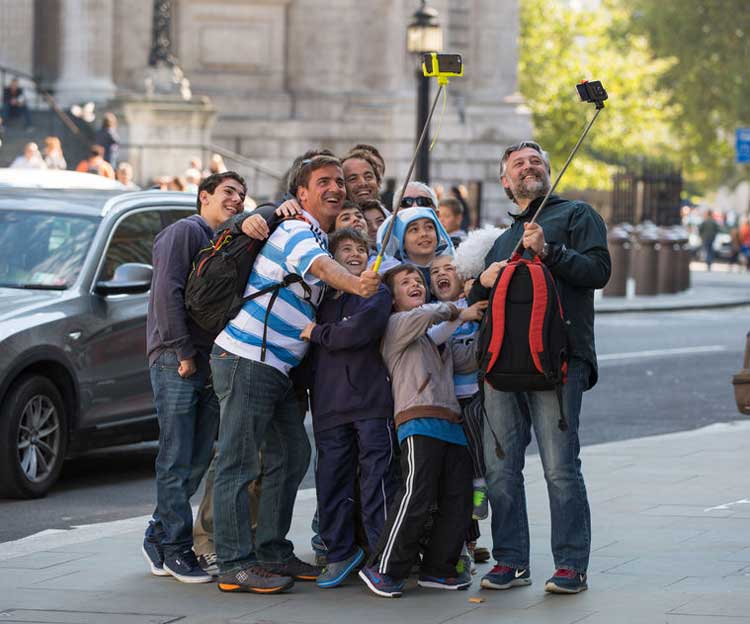 People taking a selfie on their tour.