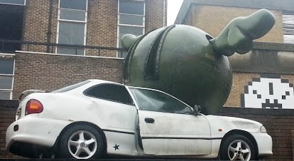 A squashed car in the Truman Brewery.